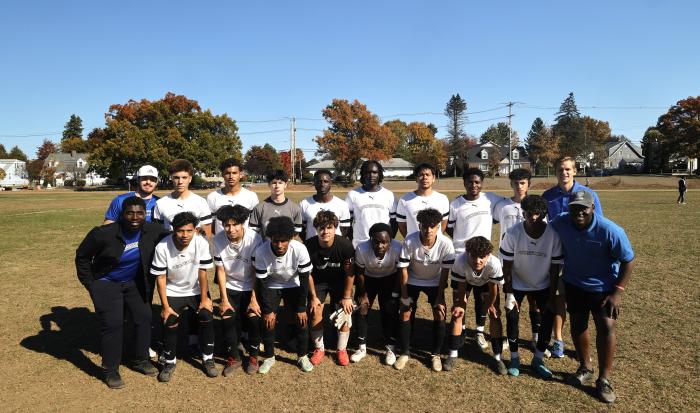 The QCC Men's Soccer team and coaches