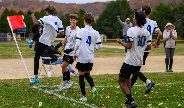 The Men's Soccer team celebrates their winning game against Springfield Technical Community College The Men's Soccer team celebrates their winning game against Springfield Technical Community College