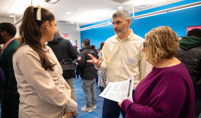 Marc Breau from the Executive Office of Health and Human Services speaks with job seekers. Marc Breau from the Executive Office of Health and Human Services speaks with job seekers.