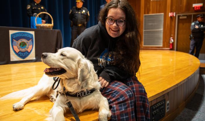 Siggy gets some pets from a student at his graduation. Siggy gets some pets from a student at his graduation.