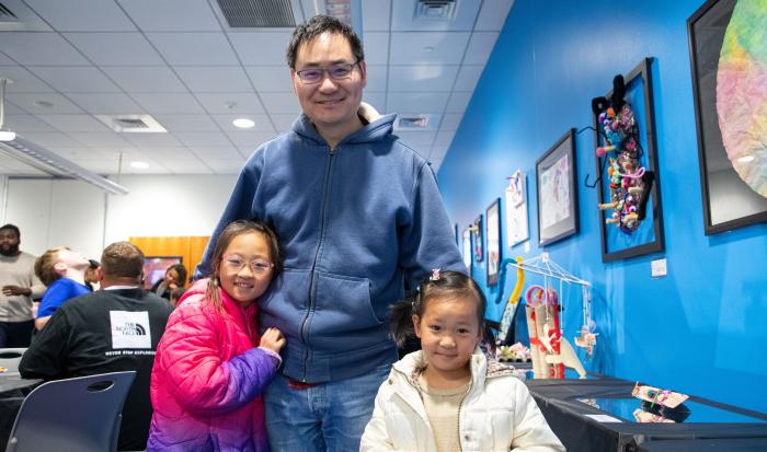 A family enjoys the art show. A family enjoys the art show.