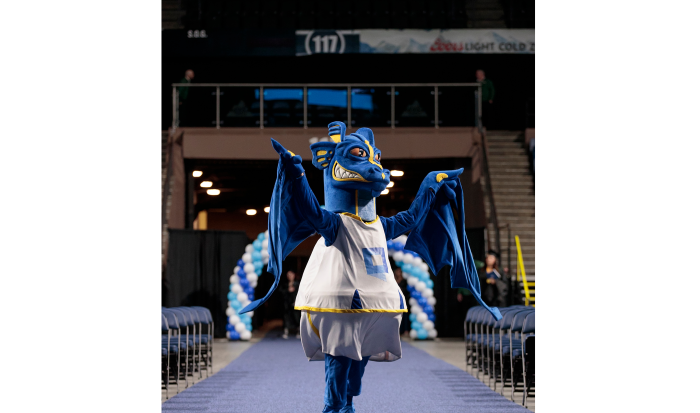 The Wyvern pumps up the crowd at the 2025 commencement ceremony.