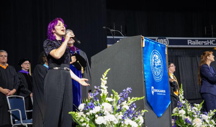 QCC student Sterling Tanacea gives a rousing rendition of The National Anthem.