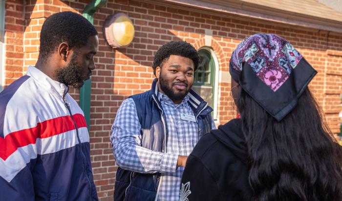 Director of Mentoring and Special Programs Kalan Lewis (center) at a mentoring event Director of Mentoring and Special Programs Kalan Lewis (center) at a mentoring event