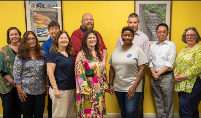 Members of the CAE (from left) Tricia LaFountaine, Joan Perry, Pam Dempsey-O'Connell, Ann Panetta, Ray Wisniewski, Amy Beaudry, Tenisha Mincey and Brooks Winchell with administrators Kevin Li and Gaelan Benway. (Not pictured members of the CAE include Sharon Marini, Nancy Donahue Berthiaume, Maureen Giacobbe and Cathy Sooy).
