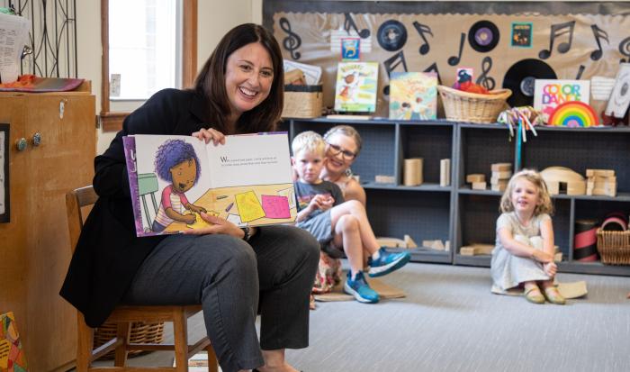 Senator Robyn Kennedy reads a book at QCC's Children's School.