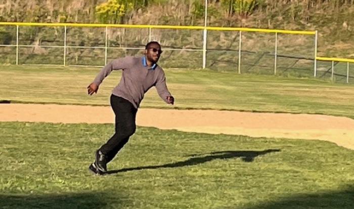 Recruitment Counselor Quincy Lester plays kickball in style. Recruitment Counselor Quincy Lester plays kickball in style.
