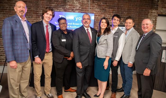 (From left) Cliff Rucker, founder of Rucker Investments and The Cliff & Susan Rucker Foundation; Noah MacDonald, QCC student; Rocky Knight, director of the Auxilium Center for Entrepreneurship at QCC; Dr. Luis Pedraja, QCC president; Stephanie Ramey, vice president of Special Projects at Rucker Investments; Jacob Rucker, co-founder of Auxilium Worcester; Zachary Dutton, executive director of Auxilium Worcester; and Tim Murray, president and CEO of Worcester Regional Chamber of Commerce (From left) Cliff Rucker, founder of Rucker Investments and The Cliff & Susan Rucker Foundation; Noah MacDonald, QCC student; Rocky Knight, director of the Auxilium Center for Entrepreneurship at QCC; Dr. Luis Pedraja, QCC president; Stephanie Ramey, vice president of Special Projects at Rucker Investments; Jacob Rucker, co-founder of Auxilium Worcester; Zachary Dutton, executive director of Auxilium Worcester; and Tim Murray, president and CEO of Worcester Regional Chamber of Commerce
