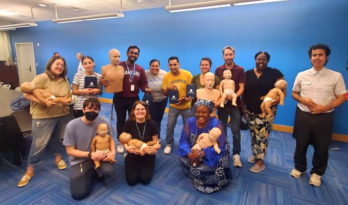 Health and Wellness Nurse Planner for Student Outreach Nikki Stewart (fourth from left) at a CPR training