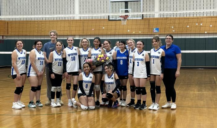 The women's volleyball team gave flowers to their only sophomore, Charlyn Cartagena - congrats Charlyn!