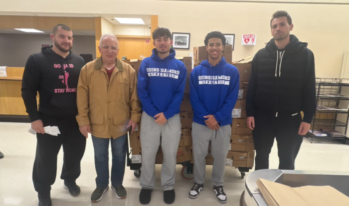 QCC Men's Basketball team pitched in to help feed families in Worcester.