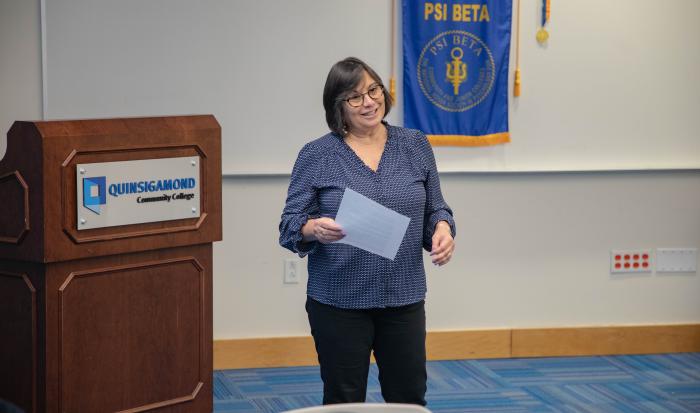 Professor of Psychology and Advisor of the Psi Beta Honor Society Valarie Clemente at the Fall 2025 induction ceremony.