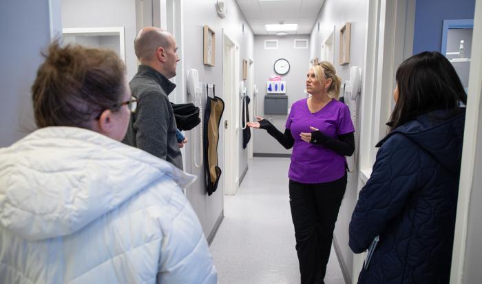 Dental Clinic Operations and Facilities Manager Rene Cummings gives a tour to representatives from The Health Foundation of Central Massachusetts.