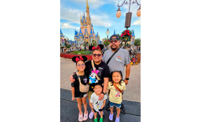Student of the Month Lina Un with her husband and children