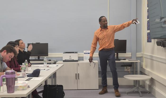 Kelo Tibbs pitching his repass service, which won third-place in QCC's qualifier.
