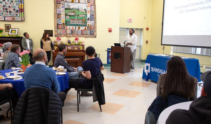 Desktop Support Technician Nader Baker speaks at the Co-Op Breakfast.