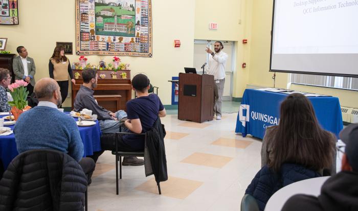 Desktop Support Technician Nader Baker speaks at the Co-Op Breakfast.