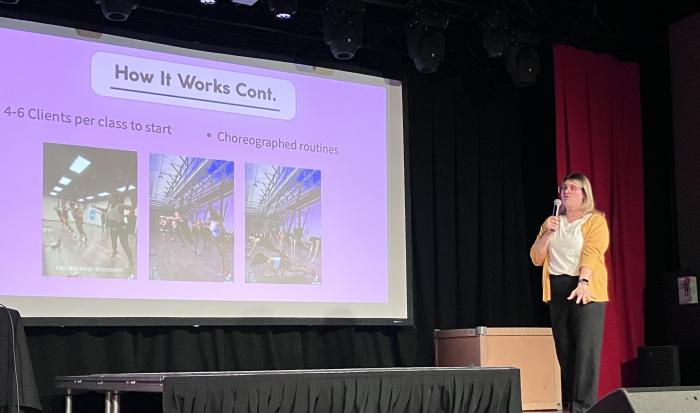 Mallory Callahan pitching her bungee fitness concept at WooTank 2026.