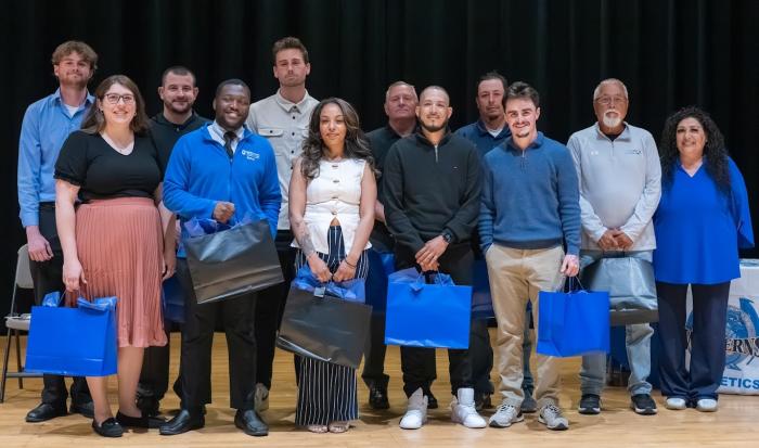The QCC coaching staff at the 2026 athletics ceremony.