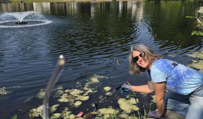 Health Consultant Mackensey Snyder went to great lengths to remove trash from the pond at University Park.