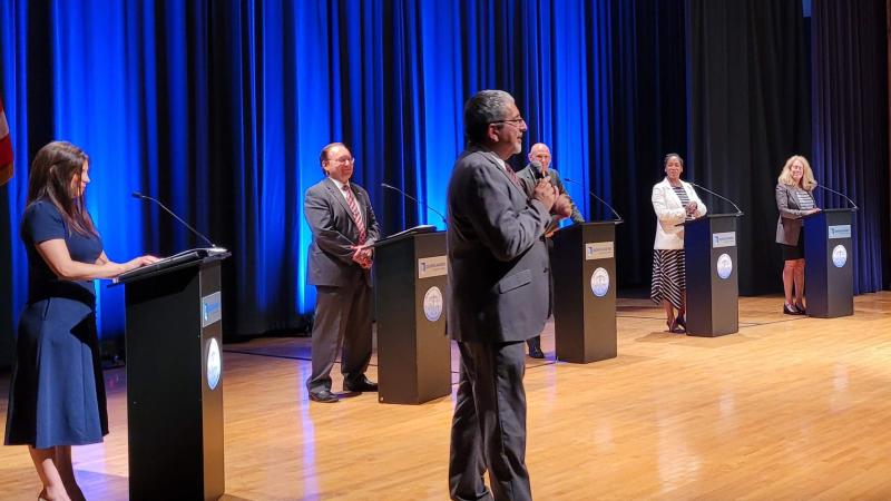 Dr. Luis Pedraja giving a welcome at the forum.