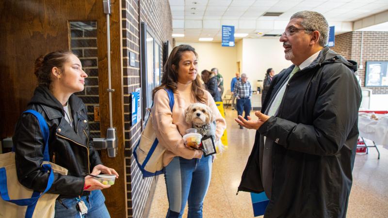Dr. Pedraja speaks with student panelists Hannah Rosenkrantz and Doretta Stoler.