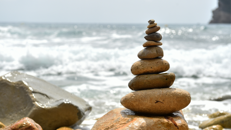 A pile of rocks on a sea shore