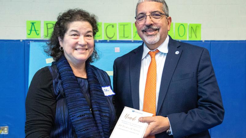 Professor Lisa Connelly Cook with President Dr. Luis Pedraja