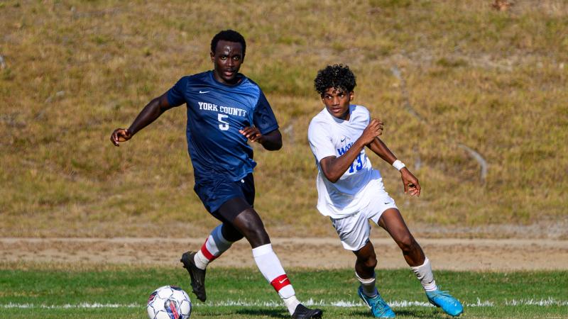 QCC's Arop Majak takes on a York County Community College player.