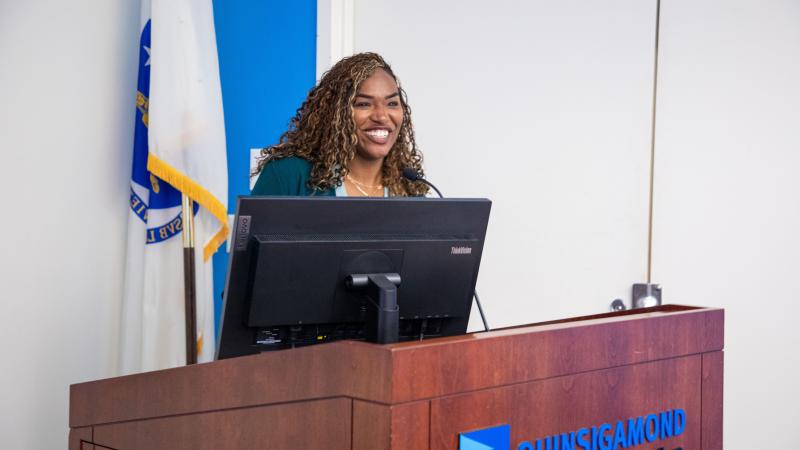IT Project Manager Angel Jackson welcomed the crowd at the J1 Kickoff Meeting.