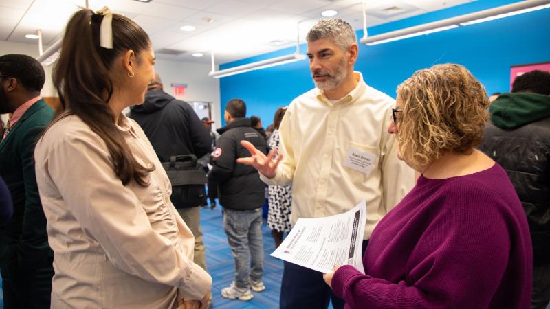 Marc Breau from the Executive Office of Health and Human Services speaks with job seekers.