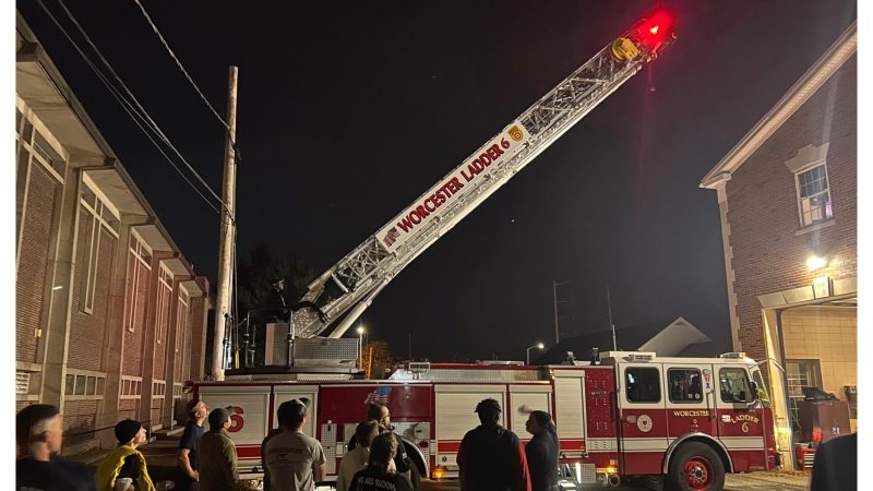 QCC Fire Science students get a close up look at a ladder truck.