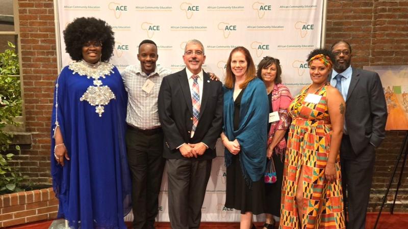 (From left) President of the Alumni Association Suzanne Graham Anderson, Academic Counselor for Gateway to College and Onsite Dual Enrollment Peter Munene, QCC President Dr. Luis Pedraja, Director of Development Michelle Vigneux, Project Manager for Apprenticeship Degree Initiatives Krista Piazza, student Santamaria Sessarego and Director of Community Engagement Sean Harris