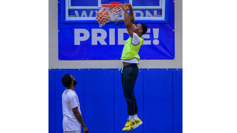 A huge slam dunk at the 2024 QCC Alumni Basketball game.