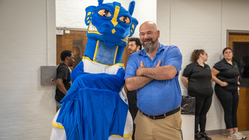 QCC student athlete Paul Landry hangs with the Wyvern at this year's athletic ceremony.