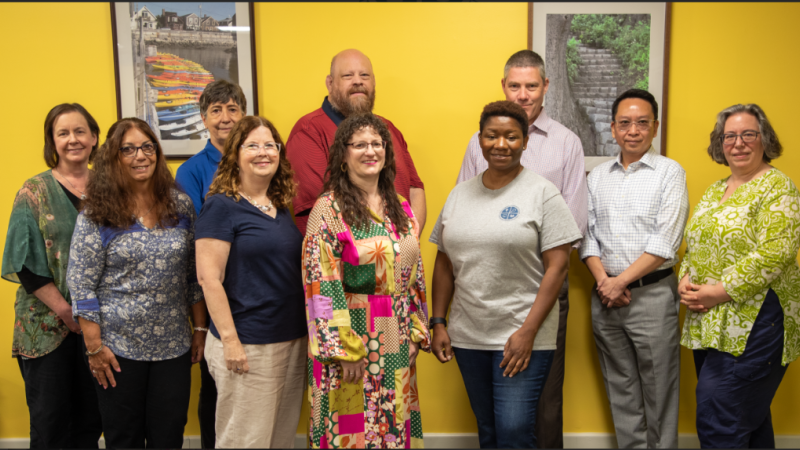 Members of the CAE (from left) Tricia LaFountaine, Joan Perry, Pam Dempsey-O'Connell, Ann Panetta, Ray Wisniewski, Amy Beaudry, Tenisha Mincey and Brooks Winchell with administrators Kevin Li and Gaelan Benway. (Not pictured members of the CAE include Sharon Marini, Nancy Donahue Berthiaume, Maureen Giacobbe and Cathy Sooy).