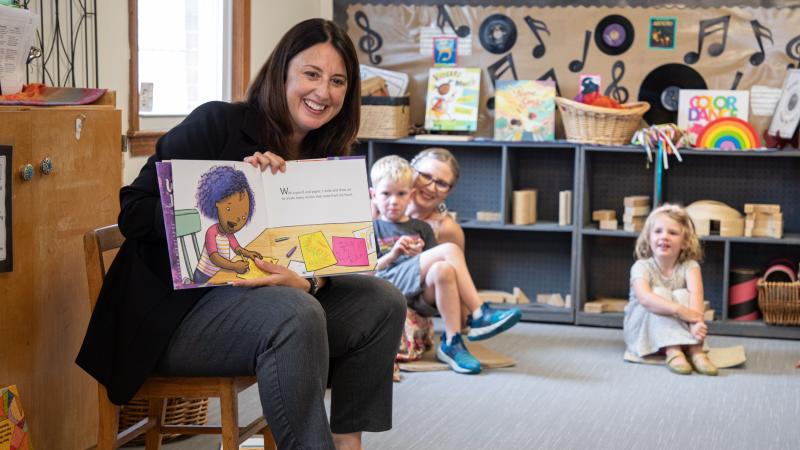 Senator Robyn Kennedy reads a book at QCC's Children's School.