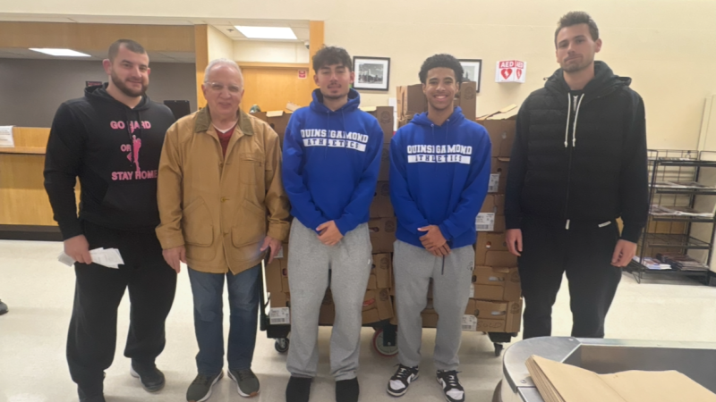 QCC Men's Basketball team pitched in to help feed families in Worcester.