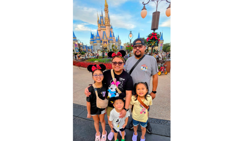 Student of the Month Lina Un with her husband and children