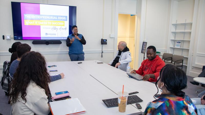 Rocky Knight (standing), director of the Auxilium Center for Entrepreneurship, during a presentation at the Center.