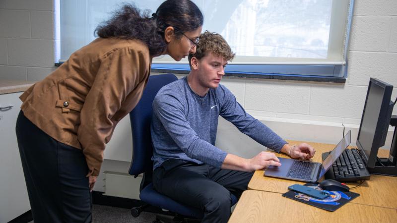 Professor of Computer Information Systems Gargi Chug helps a student.