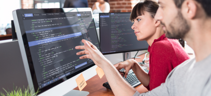 A man shows a student code on a screen