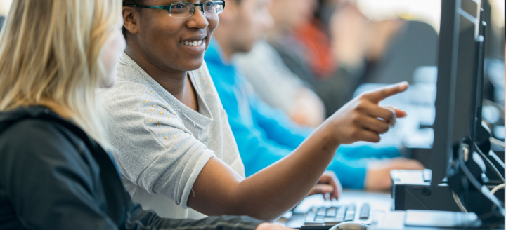 Students in a computer lab collaborate