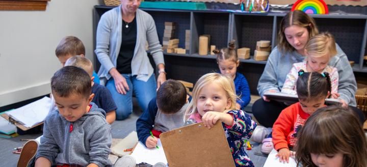 QCC students work with a class of toddlers