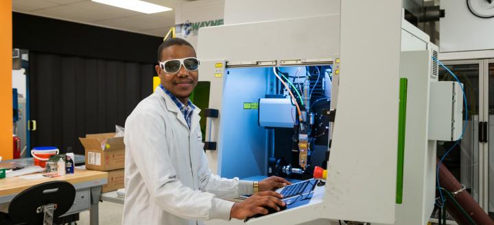 A worker at a photonics company