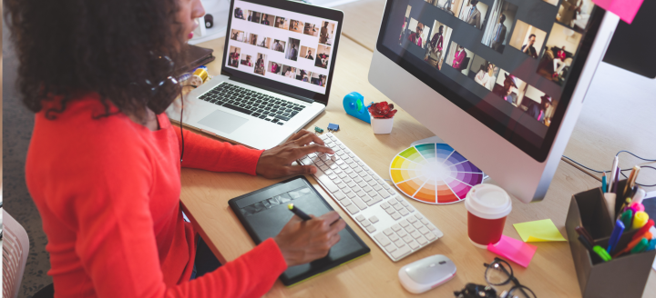 A graphic designer processes images on a computer