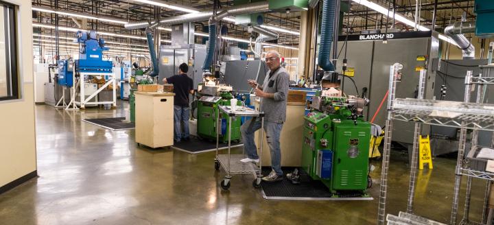 A QCC alumni works in a warehouse