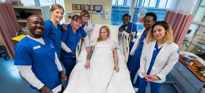 A group of nurses poses in a lab