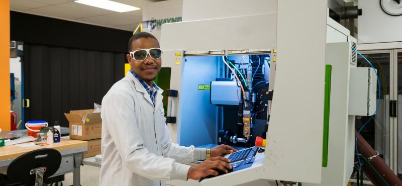 A worker at a photonics company