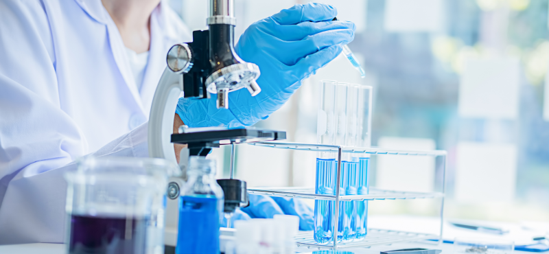 A biology lab table with various equipment